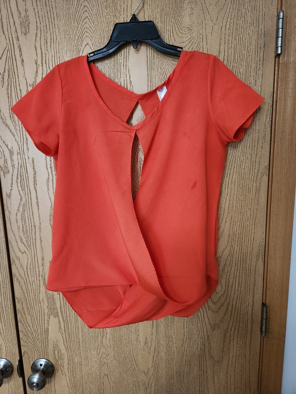 Grace Twist-Front Short Sleeve Blouse in Orange. Small Spot On The Front